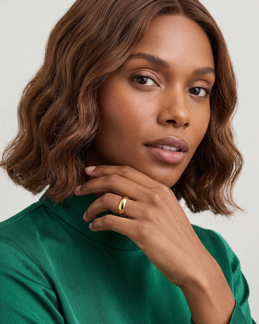 Model Image - 6mm 18k gold band ring with a smooth wide profile styled on the hand worn on model