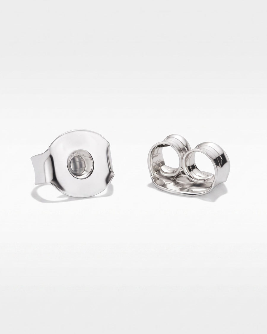 Detail Image - Rhodium earring backings for Diamond Pearl Drop Studs on a white surface