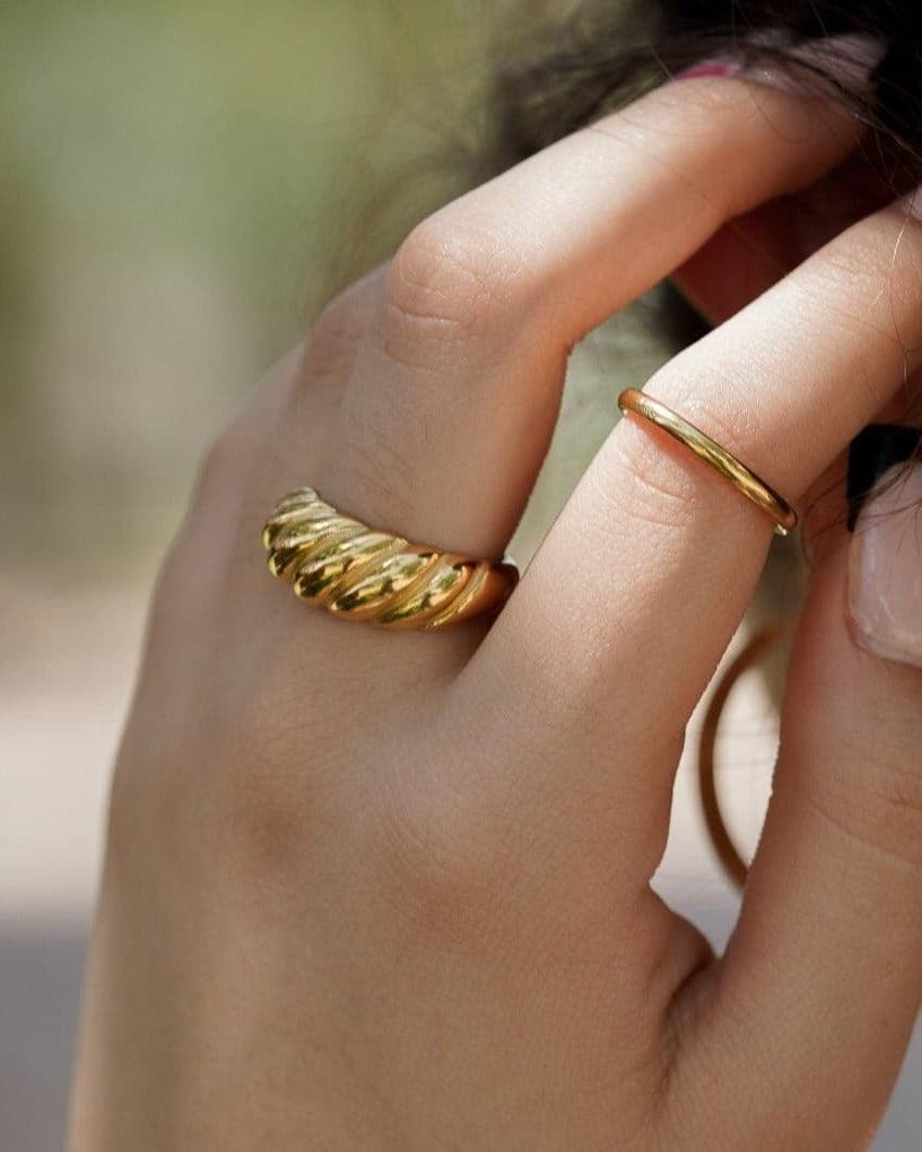 Model Image - gold Croissant Ring styled on a hand with a second slim ring nearby worn on model