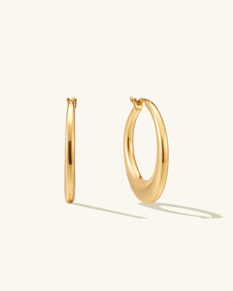 Main Image - Pair of 14K gold plated hollow hoop earrings shown upright on a light background