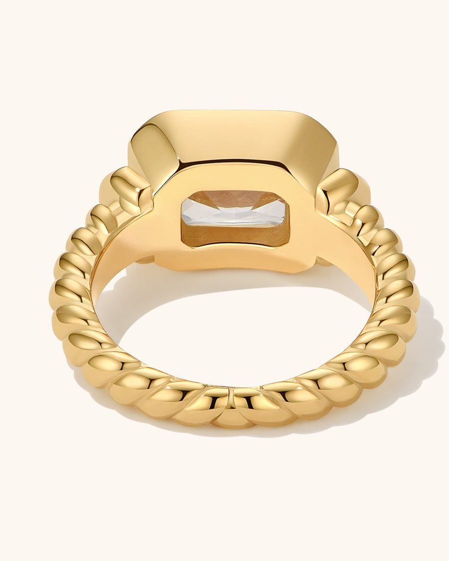 Detail Image - Twisted signet ring with diamond accent and textured band, shown from the back.