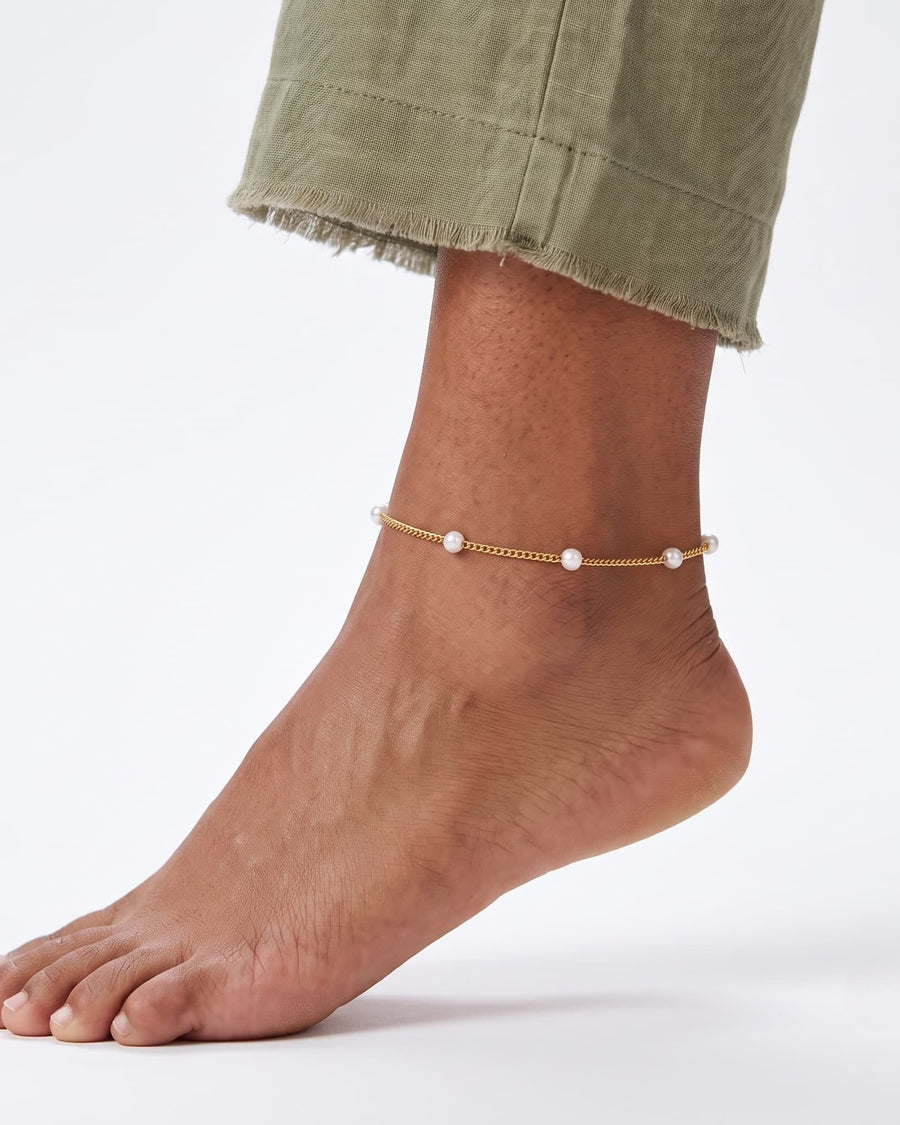 Model Image - 18k gold satellite pearl anklet with delicate pearl beads around the ankle worn on model
