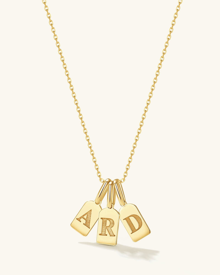 Style Image - 14K gold initial tag charm necklace with A, R, and D letter pendants on a delicate chain